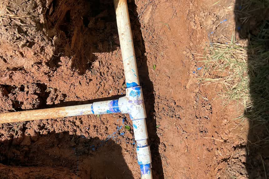 Buried mainline pipe in an open trench
